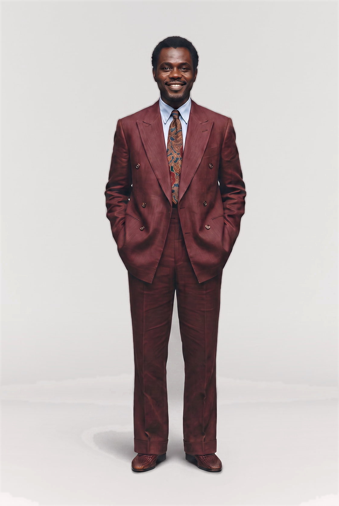 Man in a burgundy double breasted suit and paisley tie, full figure studio shot